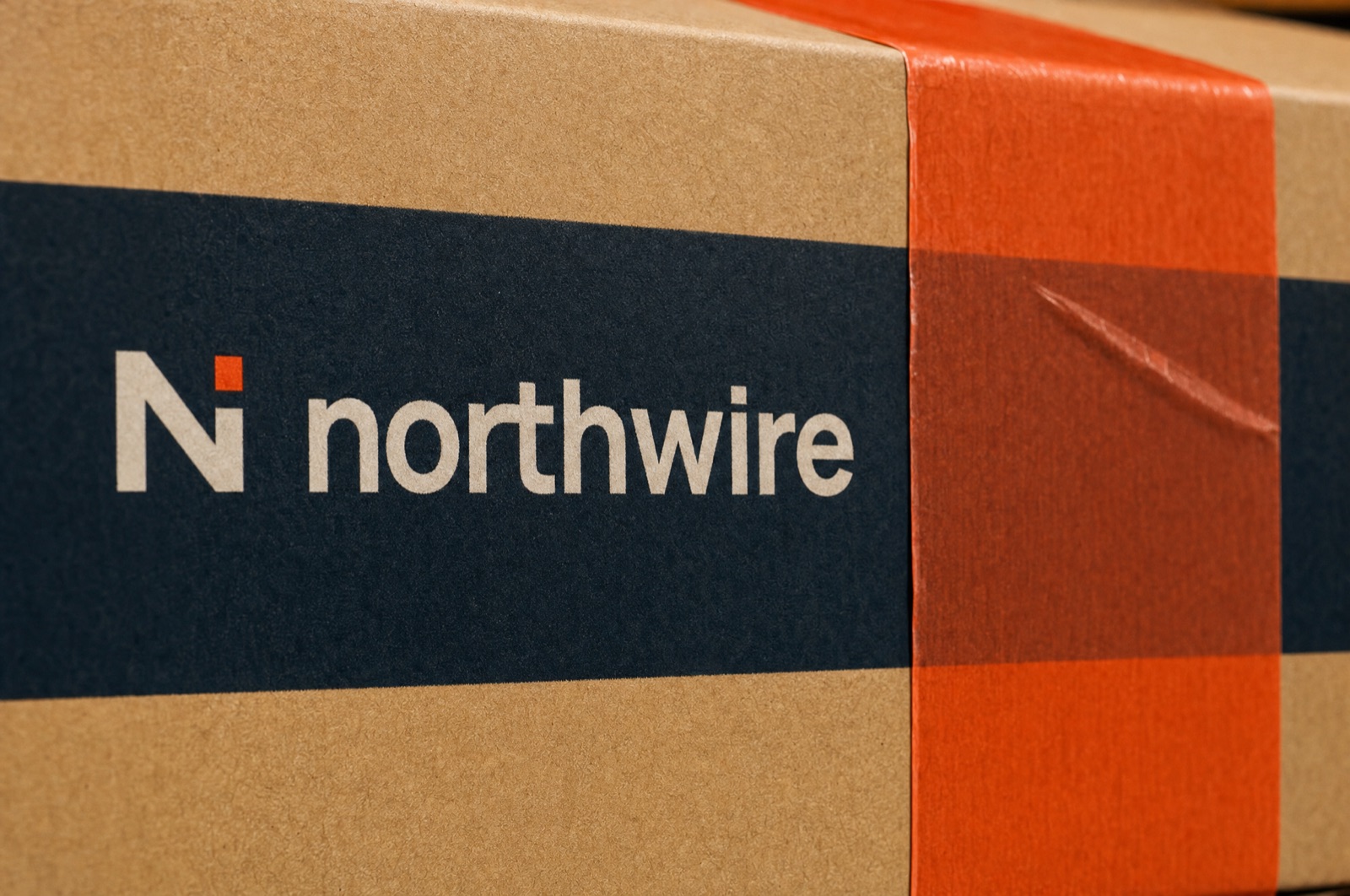 Close-up of the Northwire band and orange tape on a shipping box